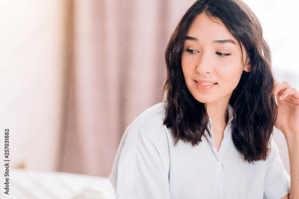 Beautiful Positive woman sitting in bed in morning Beautiful Positive woman sitting in bed in morning
