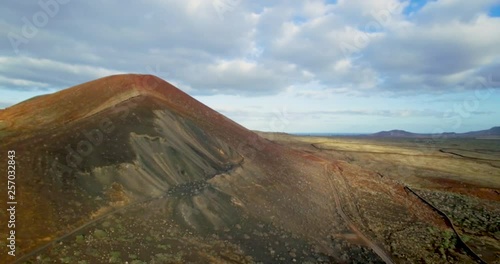 Medium drone shot of volcanic mountain in Fuerteventura.