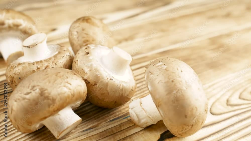 Close up of mushrooms on wood kitchen surface. Close up 4k footage. Close up of mushrooms on wood kitchen surface. Close up 4k footage.