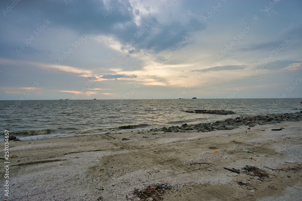 Peaceful beach view and waves during sunset at Jeram, Kuala Selangor Malaysia