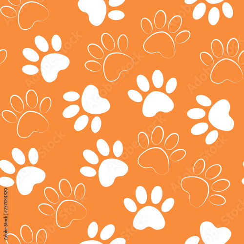 Paw print seamless. Vector illustration animal paw track orange pattern. backdrop with silhouettes of cat or dog footprint.