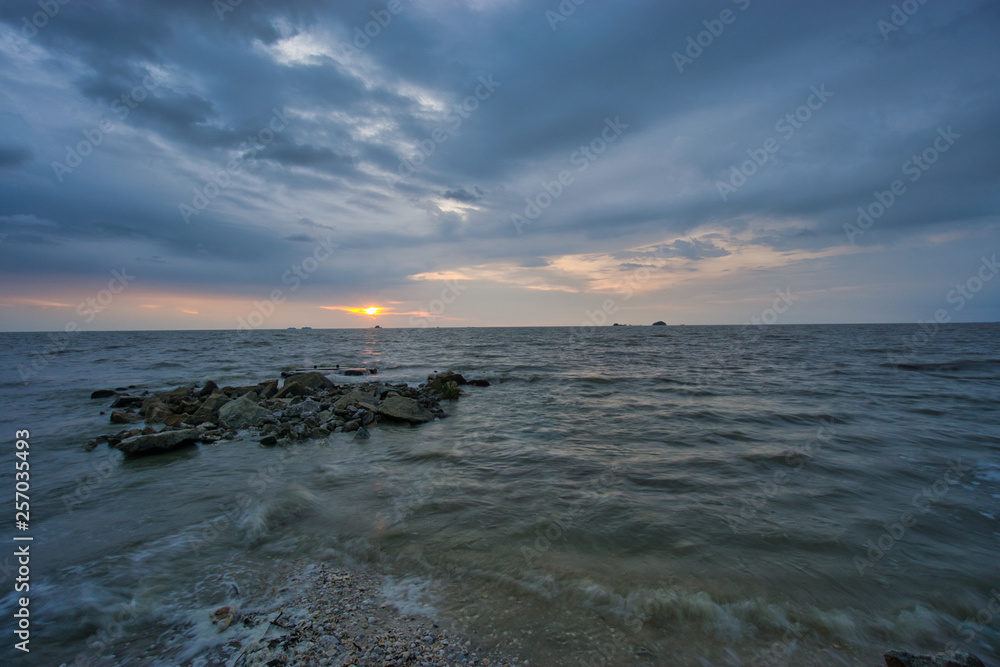 Peaceful beach view and waves during sunset at Jeram, Kuala Selangor Malaysia