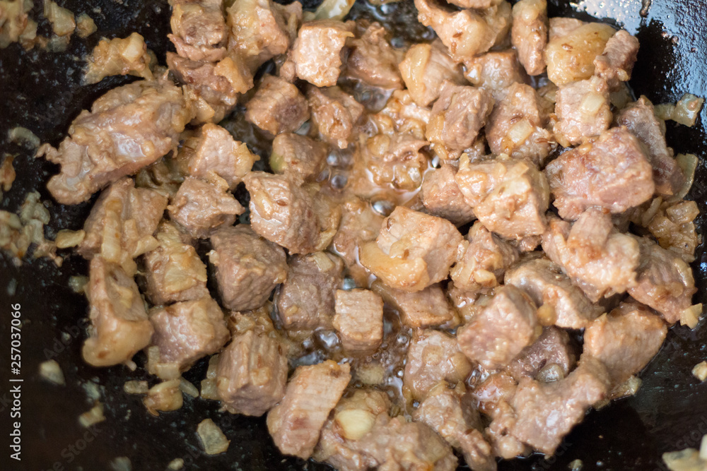 Fry meat for cooking pilaf meat with rice on fire in the cauldron. Recipe Fry meat for cooking pilaf meat with rice on fire in the cauldron. Recipe