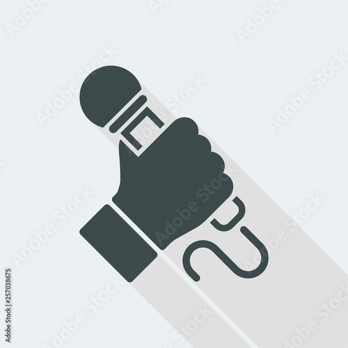 Hand holding microphone