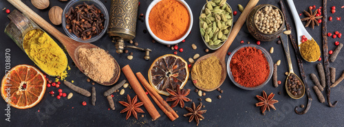 Spices and herbs. Colorful spices flat lay on wooden table