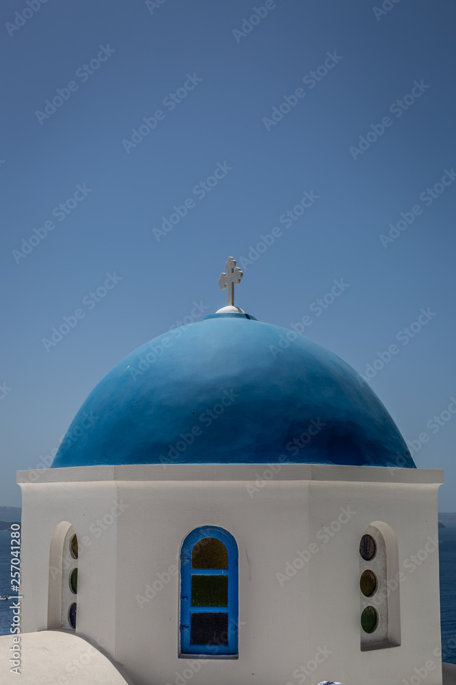 Blue roofed church dome in the islands of santorini in greece