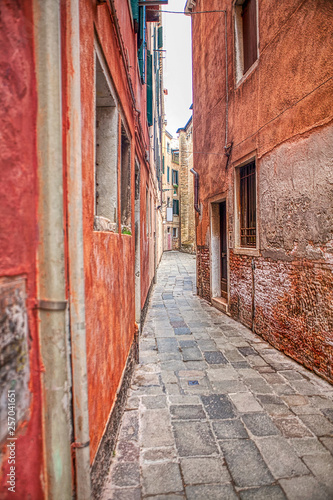 walking along narrow and old Italian street 