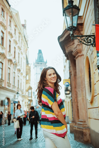 smiling modern solo traveller woman having walking tour © Alliance