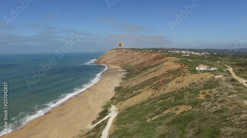 Aerial View of Paraglider Flying by