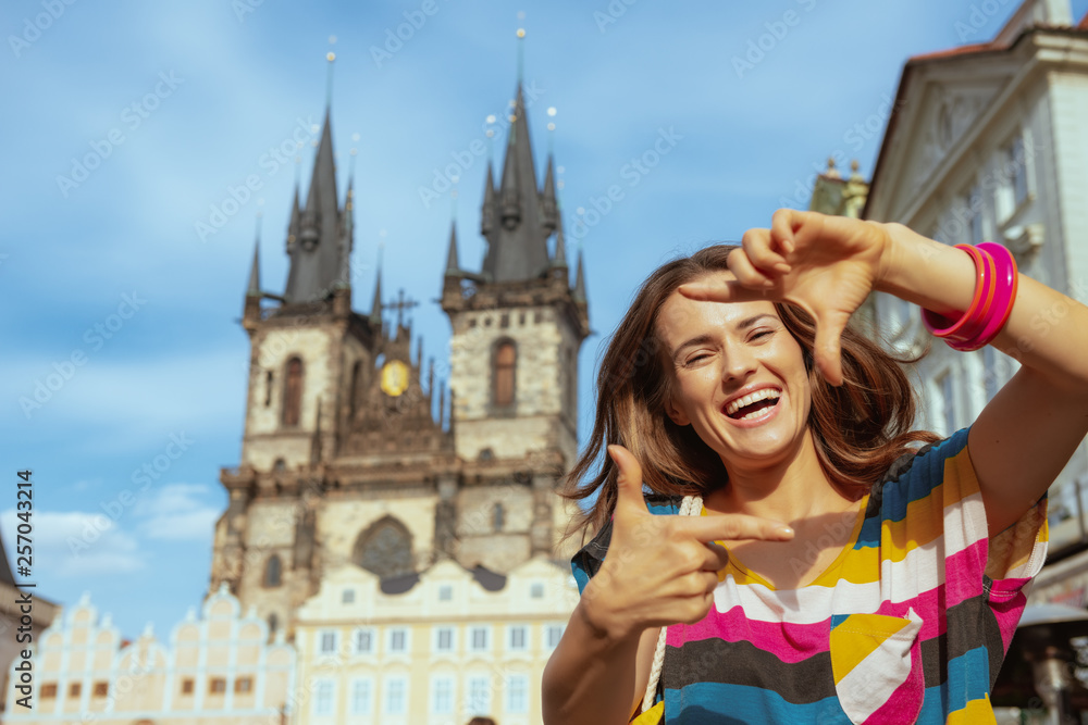 happy tourist woman framing with hands in Prague Czech Republic