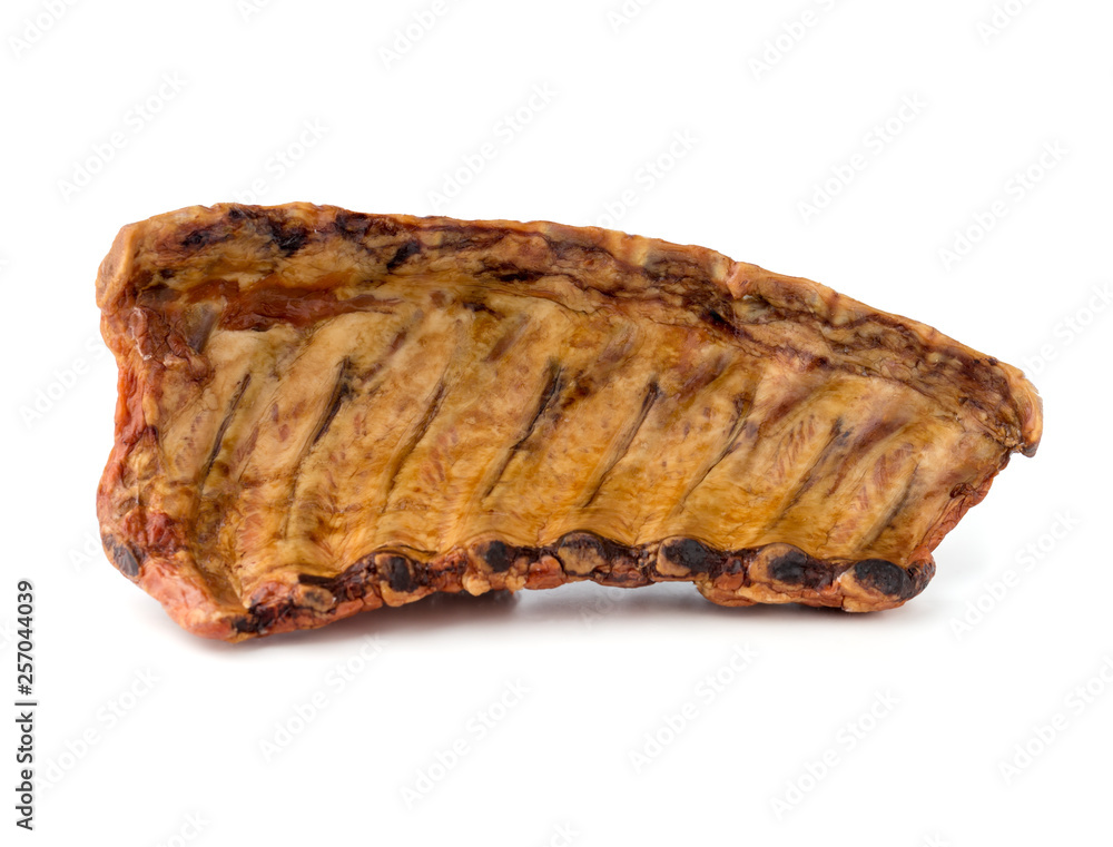 Smoked ribs on a white background. Smoked ribs close-up on a white background. Smoked ribs on a white background. Smoked ribs close-up on a white background.