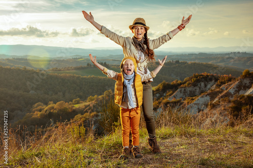 happy young mother and daughter in Tuscany ,Italy rejoicing