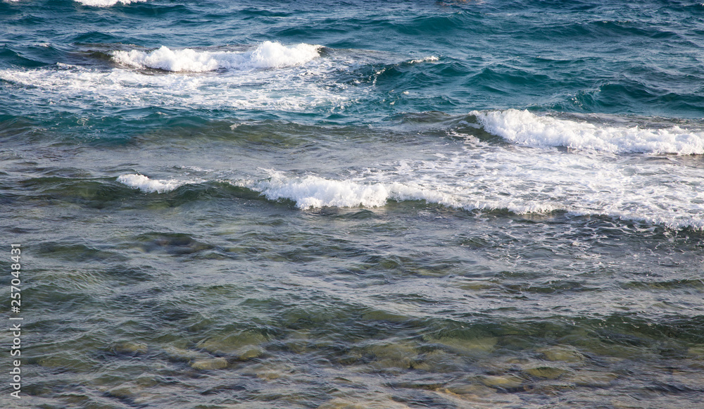 Waves in the ocean. Beautiful blue sea wave photograph close up. Beach vacation at sea or ocean. Background to insert images and text. Tourism, travel. Waves in the ocean. Beautiful blue sea wave photograph close up. Beach vacation at sea or ocean. Background to insert images and text. Tourism, travel.