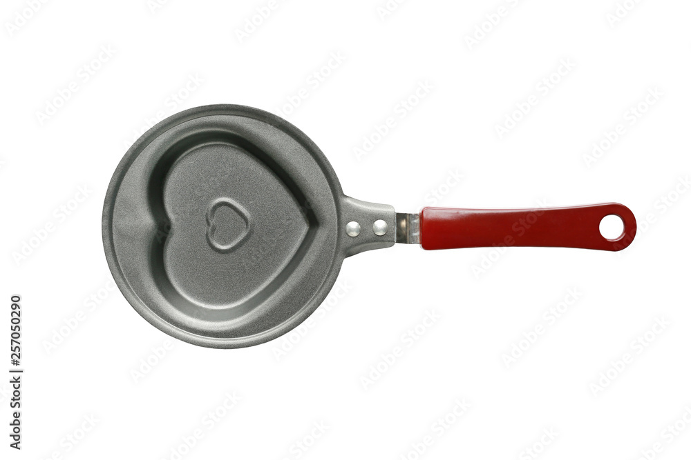 Heart shaped egg frying pan isolated on white background. Top view. Heart shaped egg frying pan isolated on white background. Top view.