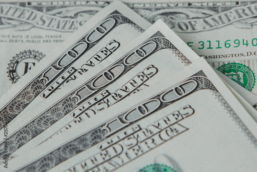 Close-up american dollar banknotes against the background of dollars Close-up american dollar banknotes against the background of dollars