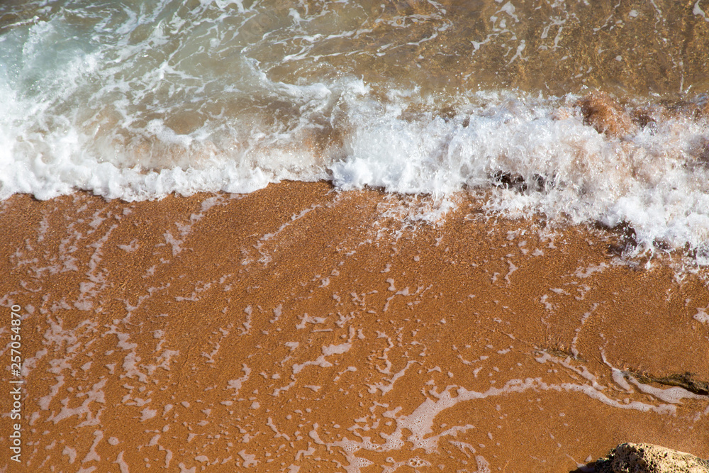 Beautiful coastline with sand and water. blue sea wave photograph close up. vacation at sea or ocean. Background to insert images and text. Tourism, travel. Beautiful coastline with sand and water. blue sea wave photograph close up. vacation at sea or ocean. Background to insert images and text. Tourism, travel.