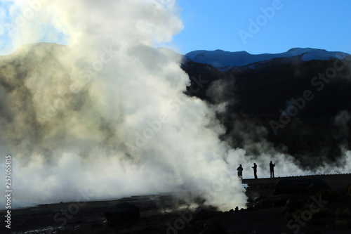 People walking in the smoke of the geysers in el tatio atacama