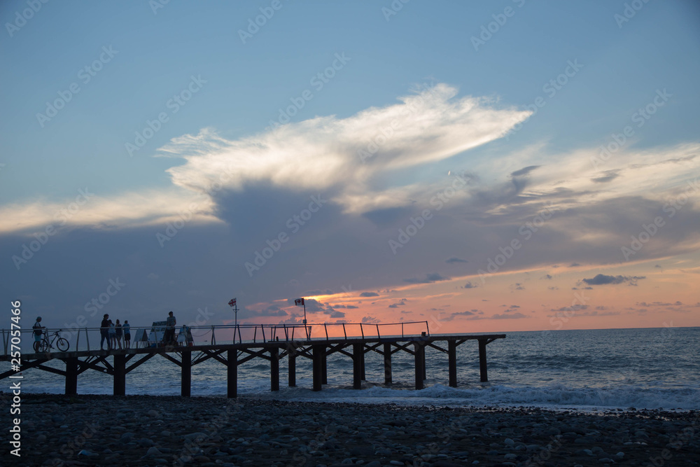 sun setting over Terrace dock or pier. Dock sea and cloudy sky background. sunset