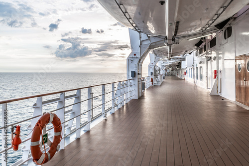 Perspective view of outdoor deck at a cruise ship with sea in the background