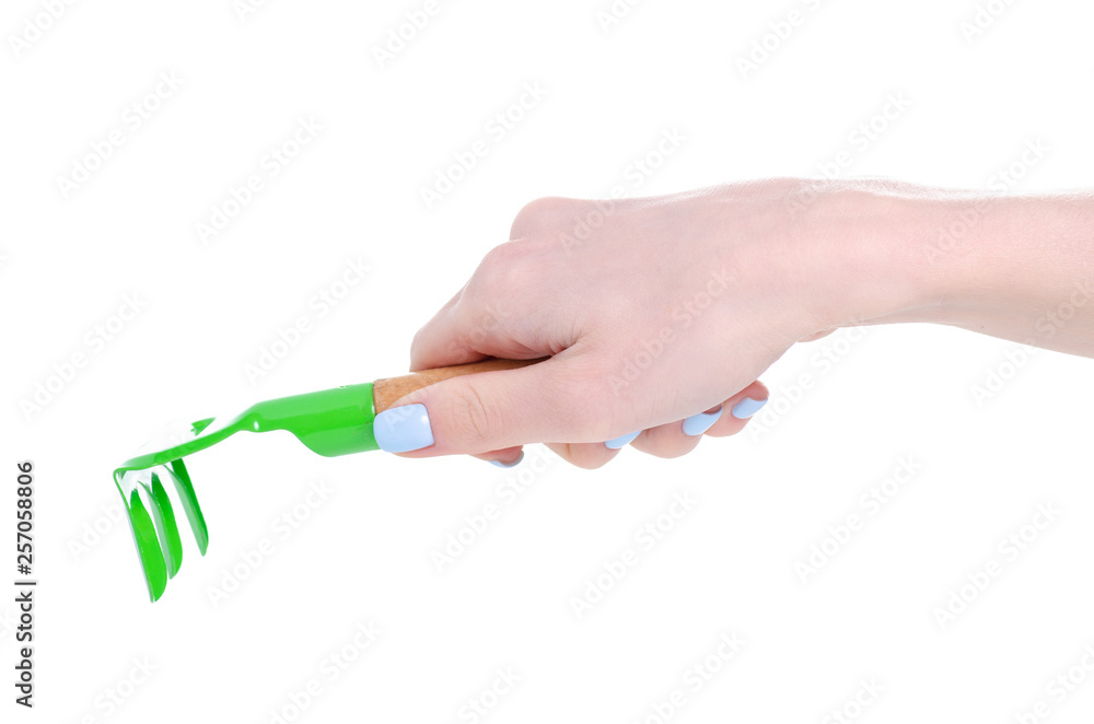 Garden rake equipment in hand on white background isolation Garden rake equipment in hand on white background isolation