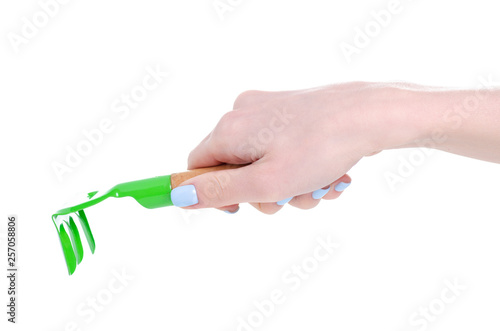 Garden rake equipment in hand on white background isolation