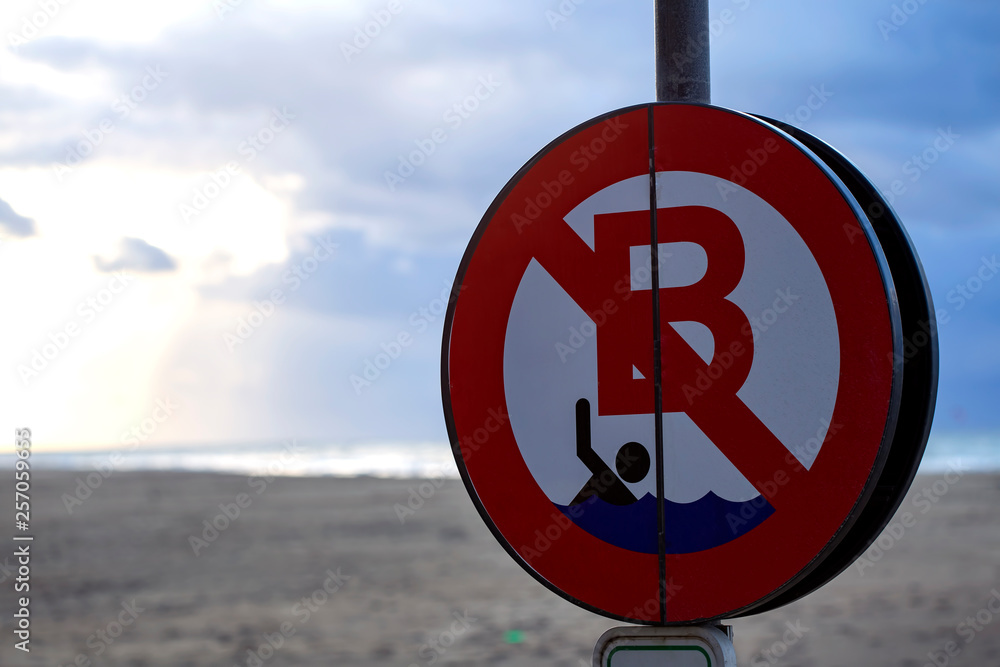 No swim sign in the North Sea beach in Ostend, Belgium