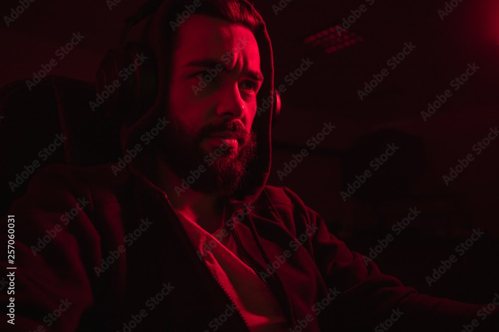 Fototapeta premium Bearded hacker in dark room