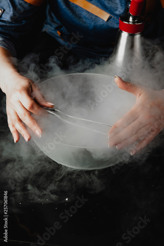 chef hands in icy smoke © Semen Evlantev