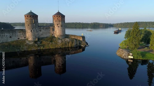 July morning at the fortress Olavinlinna (aerial video). Savonlinna, Finland