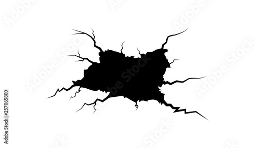 Cracked wall illustration.Cracked hole in the wall.Grunge black hole in the wall. photo