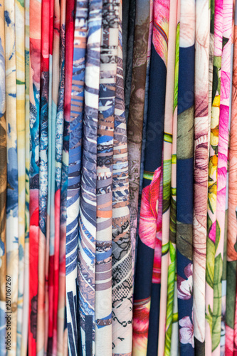 Colourful ethnic scarves in a medina location - close up and full frame. Multicolor fabric background. vertical photo