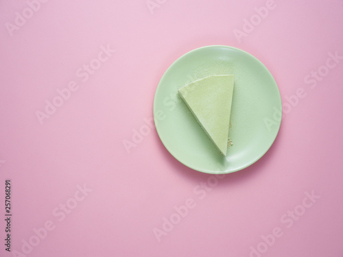 Green tea cheesecake on a green plate.