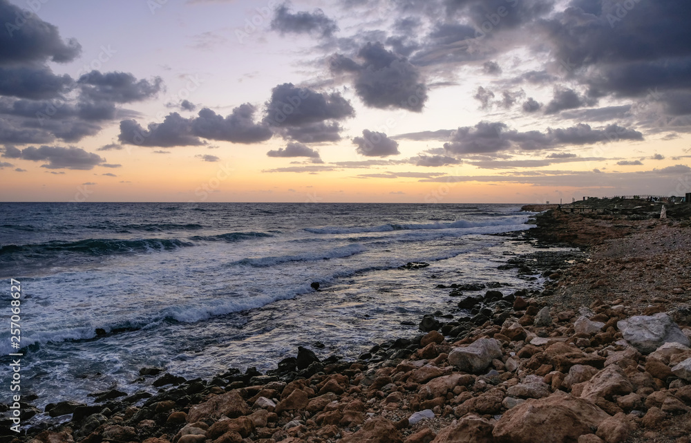 Sunset in Paphos, Cyprus. Sea and rocks, warm november day. Sunset in Paphos, Cyprus. Sea and rocks, warm november day.