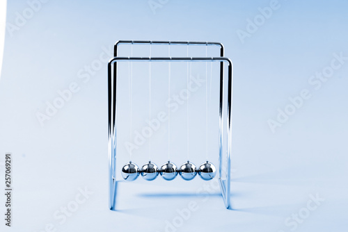 Newtons Cradle balancing balls, business concept in studio
