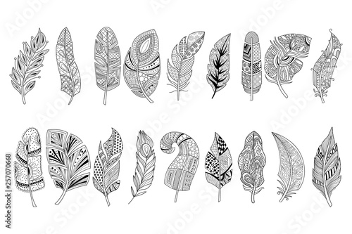 Set of black hand drawn feathers with doodle ornaments. Design for print, adult antistress coloring page or tattoo. Monochrome vector illustration in sketch style photo