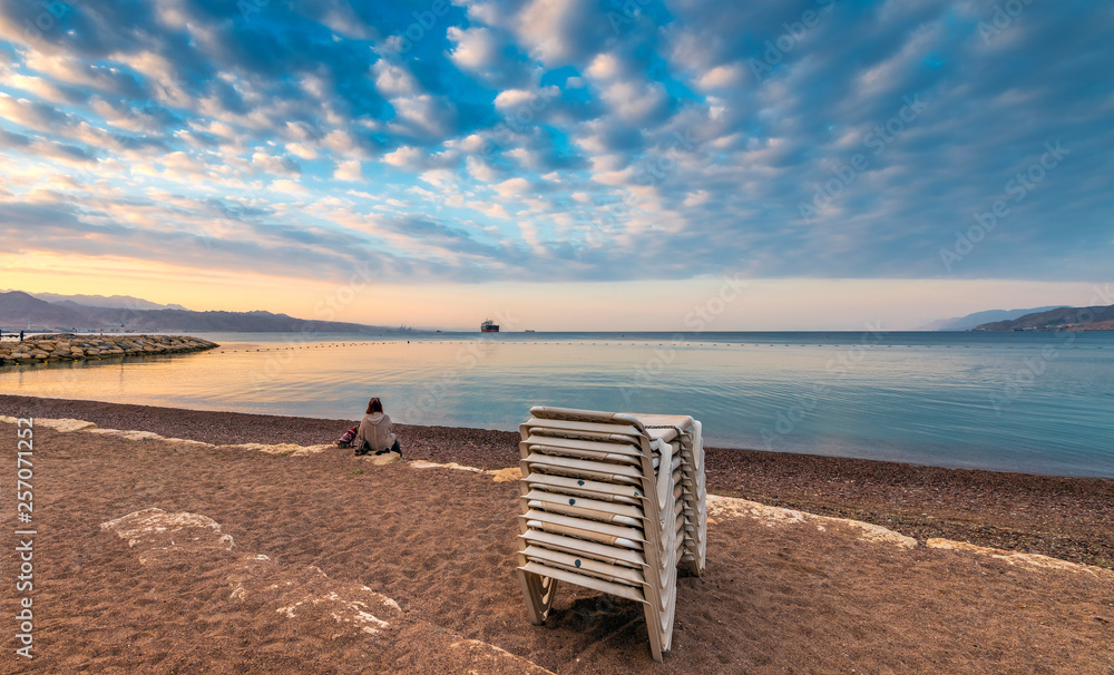 Morning relaxing atmosphere at the central public beach in Eilat - famous tourist resort city in Israel