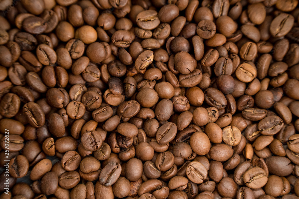 Coffee beans texture. Coffee background. A lot of coffee Coffee beans texture. Coffee background. A lot of coffee