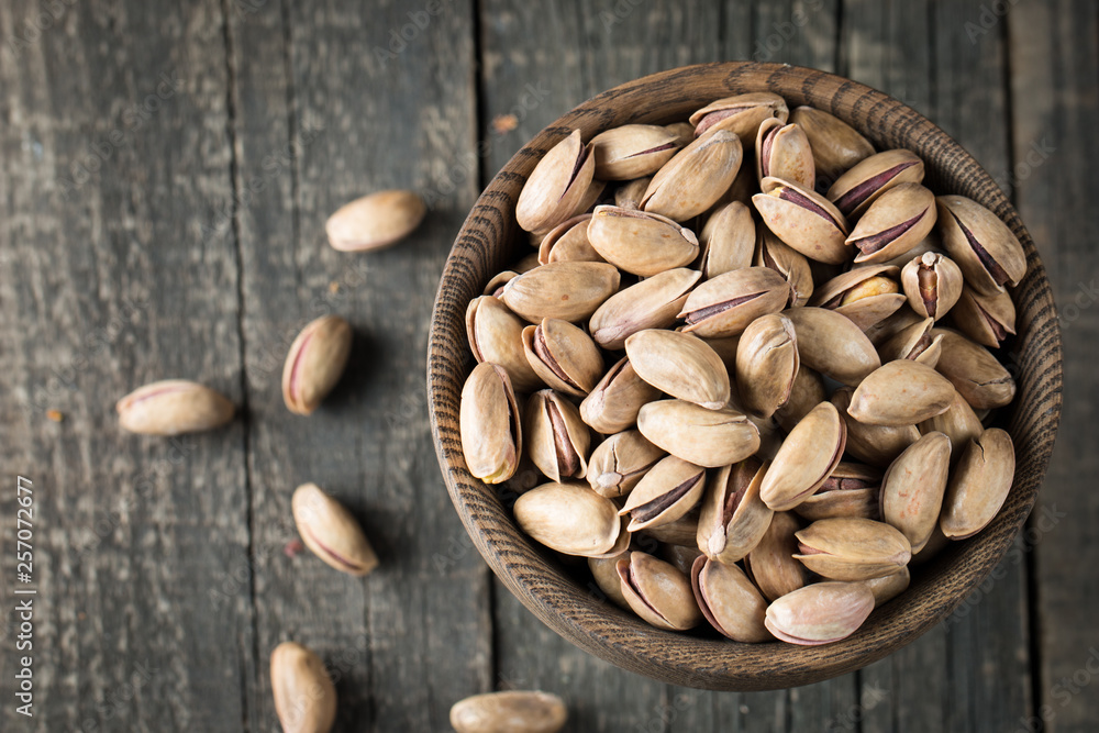 Healthy mix nuts on wooden background. Almonds, hazelnuts, cashews, peanuts, pistachios, brazilian nuts Healthy mix nuts on wooden background. Almonds, hazelnuts, cashews, peanuts, pistachios, brazilian nuts