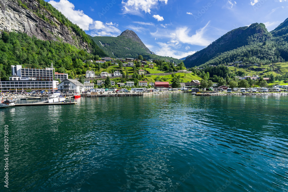 View of the Geiranger village in sunny day, located at the head of Geirangerfjord, one of the most famous destination in Norway