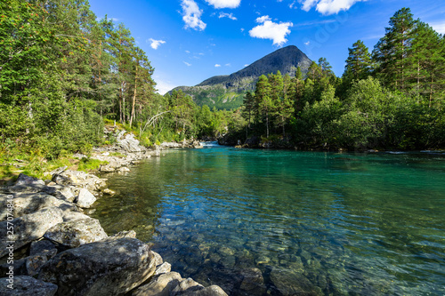 Clear waters of the Valldola River in the beautiful nature of Valldalen Valley, Sunnmore, More og Romsdal, Norway