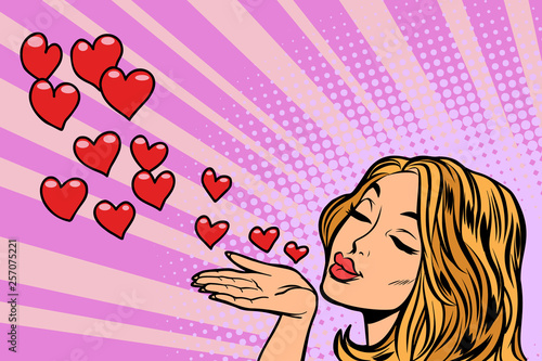 woman blowing a kiss heart