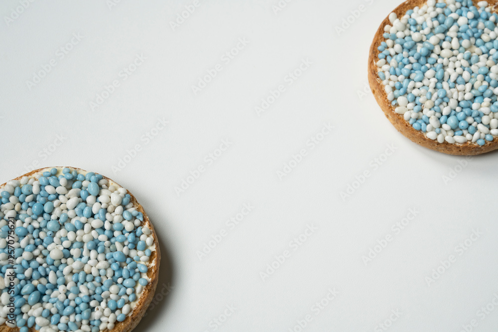 flat lay on white background. Rusk with blue aniseed balls, muisjes. Tradition in the Netherlands to celebrate the birth of a son. white background flat lay on white background. Rusk with blue aniseed balls, muisjes. Tradition in the Netherlands to celebrate the birth of a son. white background