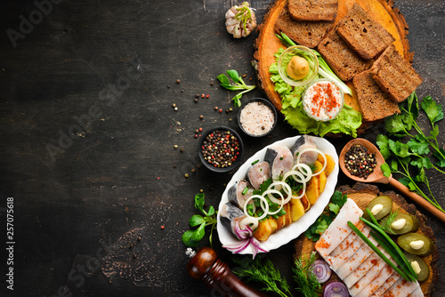 Dishes Ukrainian Traditional Cuisine. Fish, lard, bread and mustard. On the old background. free copying space.