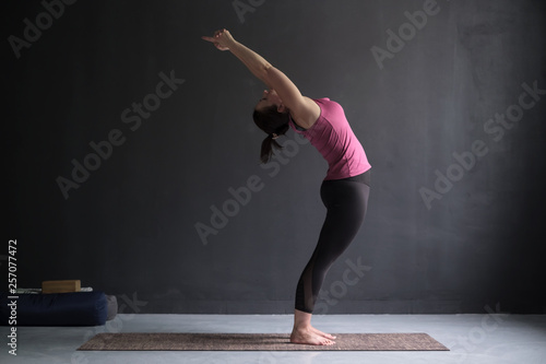 Woman practice duing sun solutation. Yoga concept. photo