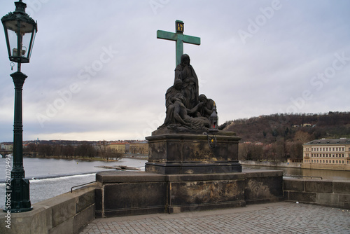 Prague, Czech Republic - March 04, 2019: Sculpture on the Charles Bridge - Lamentation of Christ, an episode of the Passion of Christ