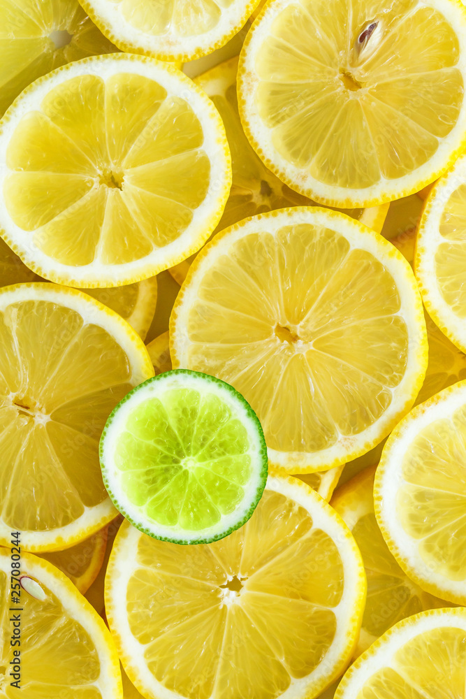 Lemon slices with one cut lime slice closeup