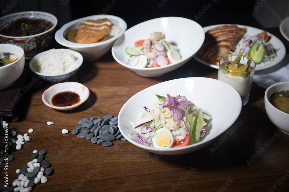 Close up view of plate with japanese food inside. Japan traditional food on wooden table. Close up view of plate with japanese food inside. Japan traditional food on wooden table.