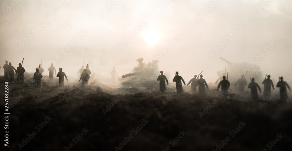 War Concept. Military silhouettes fighting scene on war fog sky background, World War Soldiers Silhouettes Below Cloudy Skyline at sunset. Attack scene. Armored vehicles. - obrazy, fototapety, plakaty 