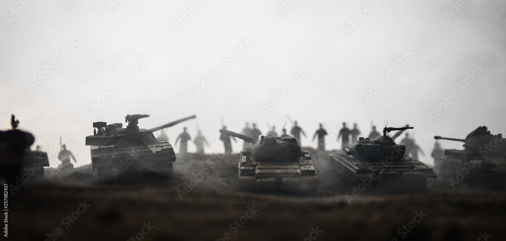 War Concept. Military silhouettes fighting scene on war fog sky background, World War Soldiers Silhouettes below Cloudy Skyline at sunset. Attack scene. Armored vehicles.