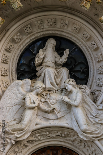 Religious statue with god and two angels